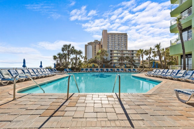 view of swimming pool featuring a patio area