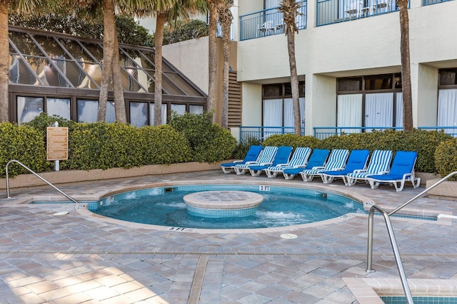 view of swimming pool featuring a patio