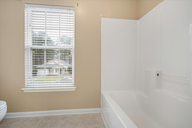 bathroom featuring tile patterned floors and toilet