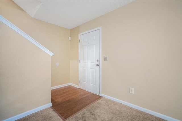 interior space with a textured ceiling