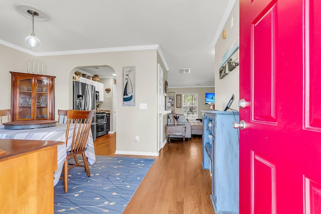 544 Beverly Dr, Summerville, SC 29485 - foyer with visible vents, baseboards, arched walkways, crown molding, and wood finished floors