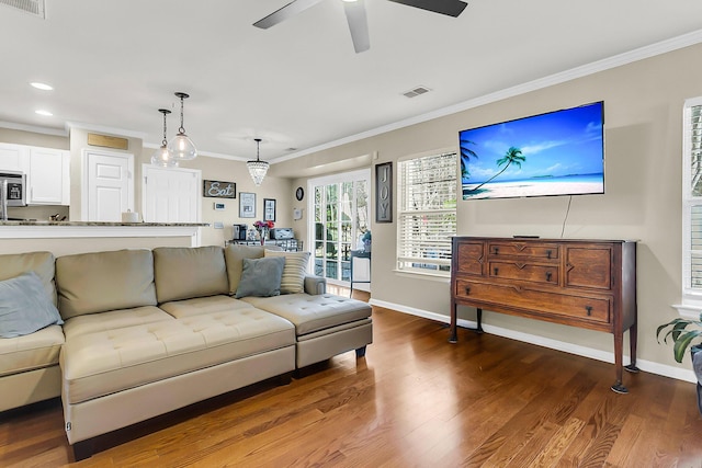 544 Beverly Dr, Summerville, SC 29485 - living room featuring wood finished floors, baseboards, ornamental molding, and visible vents