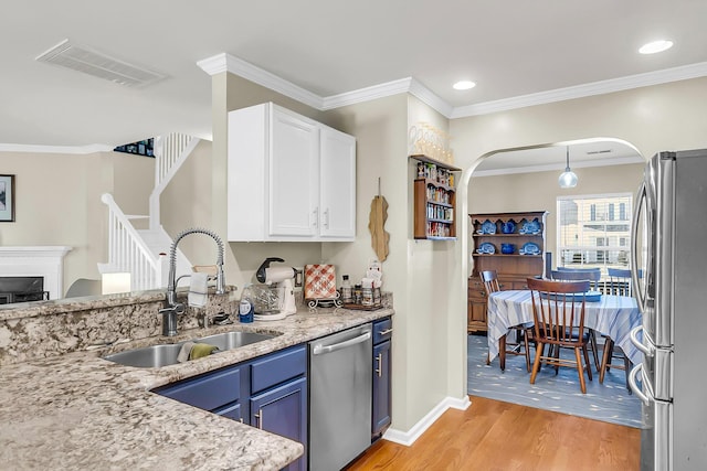 544 Beverly Dr, Summerville, SC 29485 - kitchen featuring blue cabinetry, white cabinetry, visible vents, a sink, and stainless steel appliances