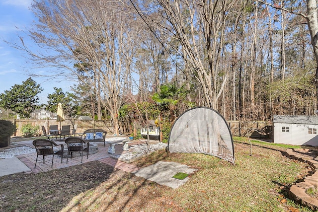 544 Beverly Dr, Summerville, SC 29485 - view of yard with a patio, a fenced backyard, and an outbuilding