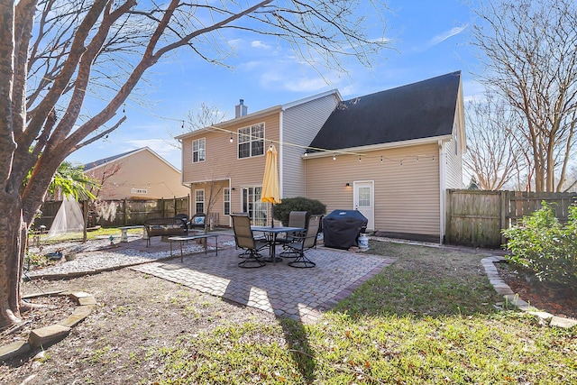 544 Beverly Dr, Summerville, SC 29485 - back of property with a patio, a chimney, and a fenced backyard