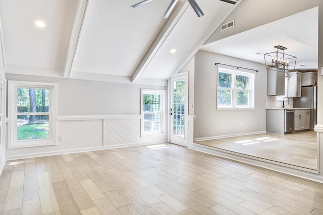 1052 Yorktown Dr, Charleston, SC 29412 - unfurnished living room featuring light wood-style flooring, a chandelier, wainscoting, ceiling fan, and recessed lighting