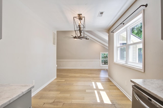 1052 Yorktown Dr, Charleston, SC 29412 - unfurnished dining area with light wood-type flooring, healthy amount of natural light, lofted ceiling, and a chandelier