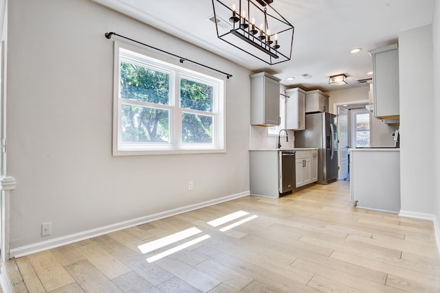 1052 Yorktown Dr, Charleston, SC 29412 - kitchen featuring gray cabinetry, appliances with stainless steel finishes, light wood-style floors, light countertops, and recessed lighting