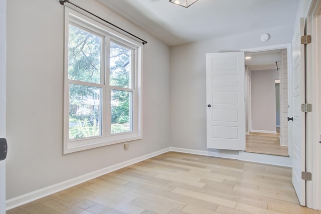 1052 Yorktown Dr, Charleston, SC 29412 - empty room with healthy amount of natural light, light wood-style flooring, and a smoke detector