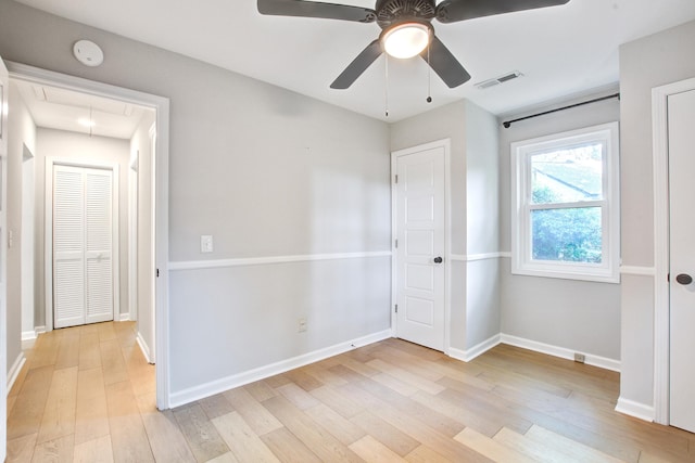 1052 Yorktown Dr, Charleston, SC 29412 - unfurnished bedroom with attic access, light wood finished floors, and ceiling fan