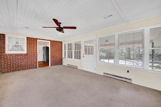 unfurnished sunroom featuring ceiling fan, baseboard heating, and visible vents
