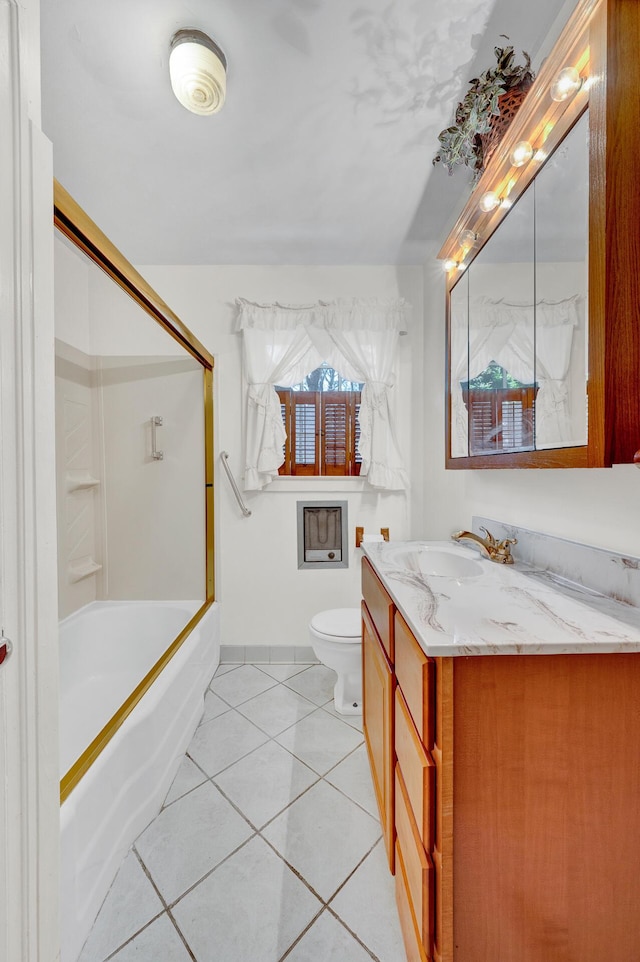full bathroom featuring bath / shower combo with glass door, toilet, tile patterned flooring, and vanity