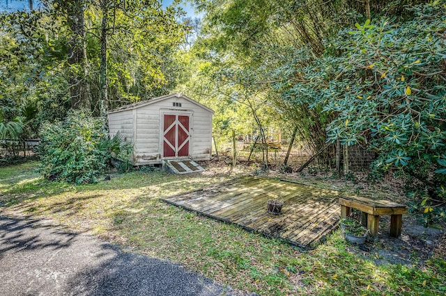 view of yard with a shed and an outbuilding