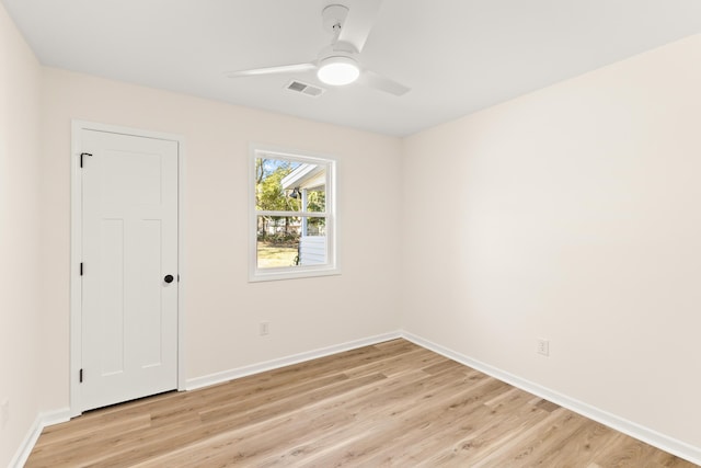 unfurnished room with ceiling fan and light wood-type flooring