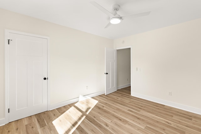 unfurnished room with ceiling fan and light wood-type flooring