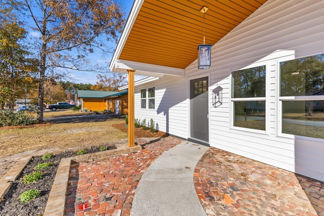 doorway to property with a patio area