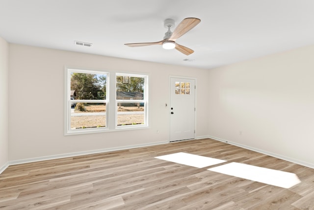 spare room with ceiling fan and light hardwood / wood-style flooring