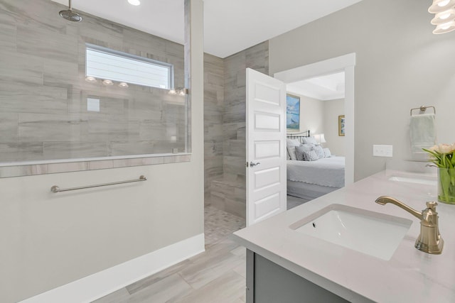 bathroom featuring vanity and a tile shower