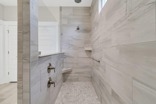 bathroom with tiled shower