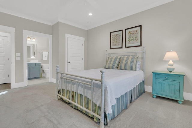 carpeted bedroom featuring connected bathroom, crown molding, and ceiling fan