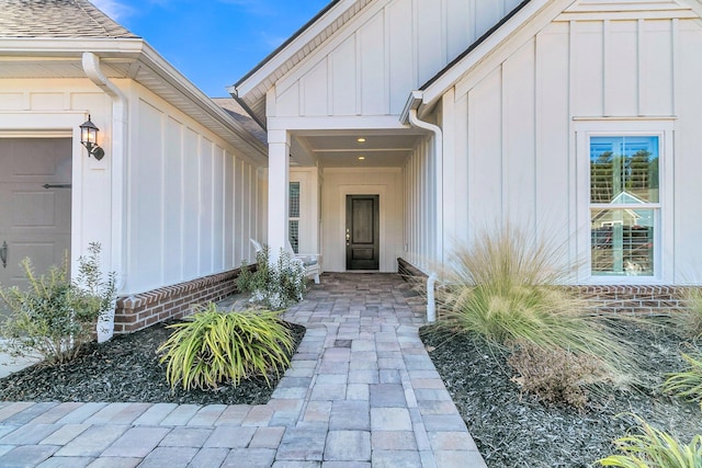 view of exterior entry featuring a garage