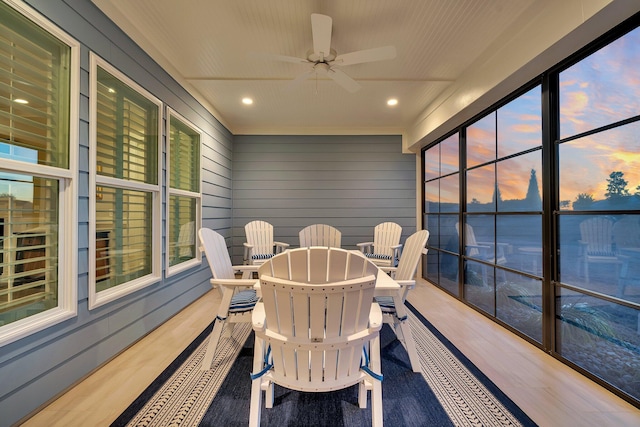 sunroom with ceiling fan and a healthy amount of sunlight