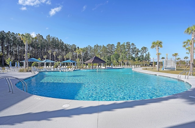 view of swimming pool featuring a gazebo