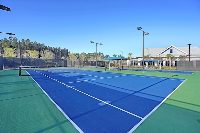 view of tennis court with basketball court