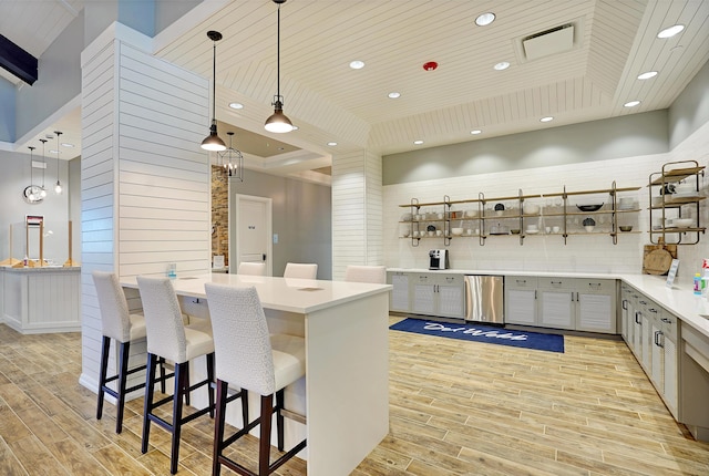 bar with gray cabinetry, wood ceiling, decorative light fixtures, and dishwasher