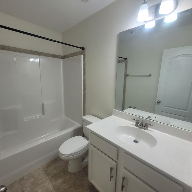 bathroom with tile patterned flooring, shower / tub combination, vanity, and toilet