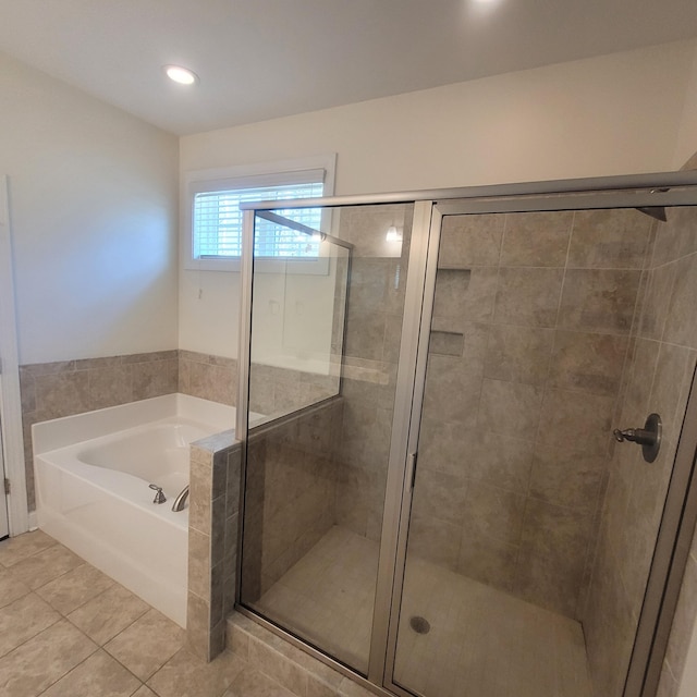 full bathroom featuring recessed lighting, a garden tub, tile patterned flooring, and a shower stall