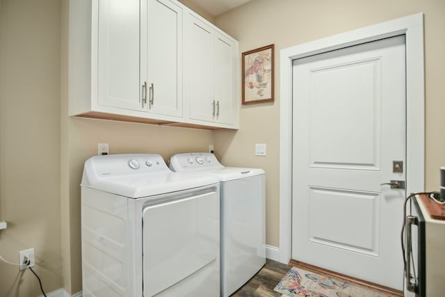 washroom with washer and clothes dryer, dark hardwood / wood-style flooring, and cabinets