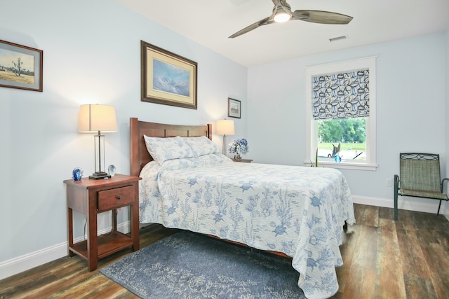 bedroom with ceiling fan and dark hardwood / wood-style flooring