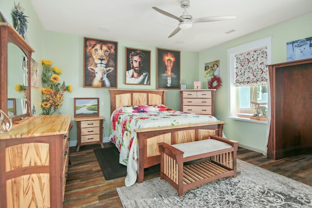 bedroom with ceiling fan and dark hardwood / wood-style flooring