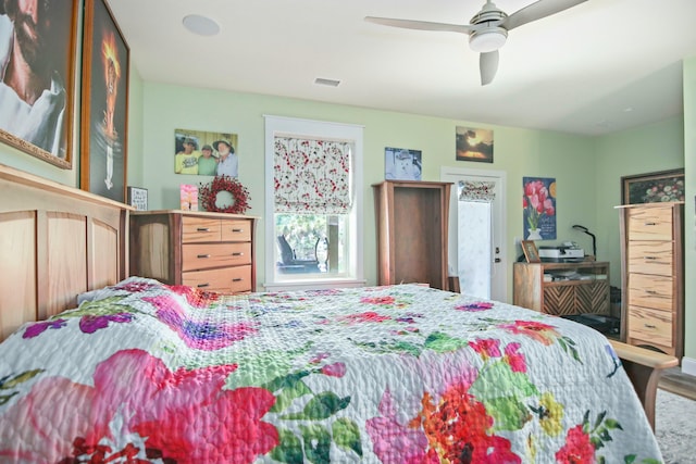 bedroom with ceiling fan and wood-type flooring