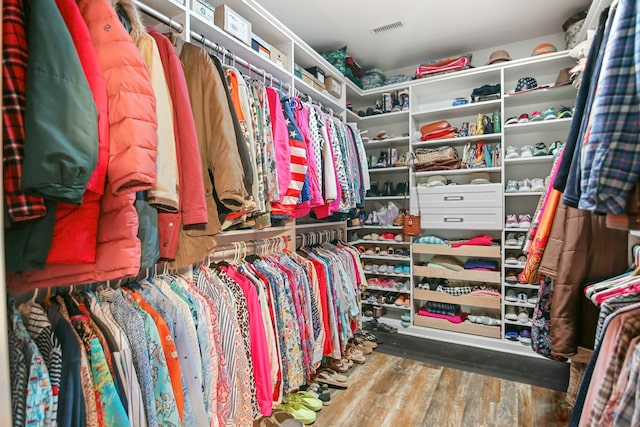 walk in closet featuring hardwood / wood-style flooring