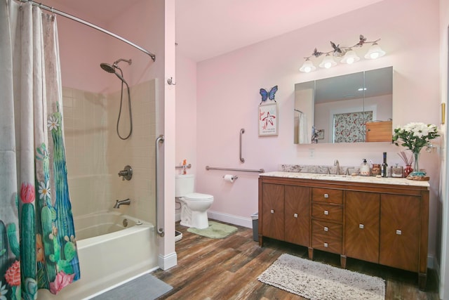 full bathroom featuring vanity, hardwood / wood-style flooring, toilet, and shower / bath combo with shower curtain