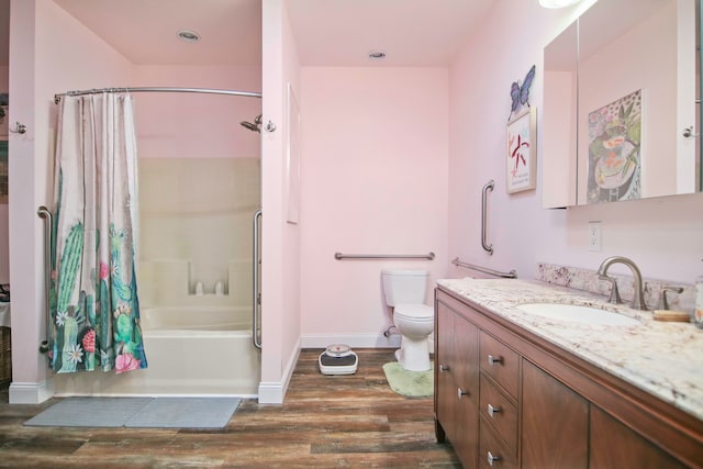 full bathroom featuring shower / tub combo with curtain, vanity, wood-type flooring, and toilet