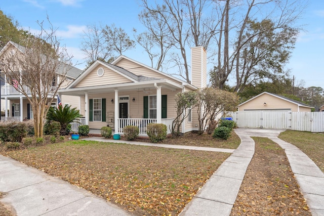 bungalow with a garage and a porch