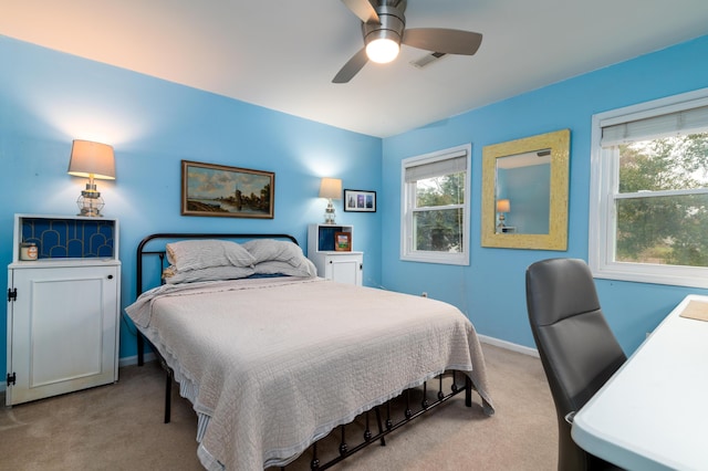 bedroom with light colored carpet and ceiling fan