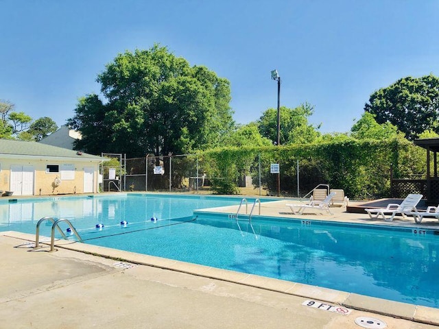 view of swimming pool featuring a patio area