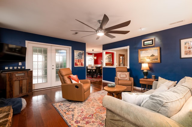 living room featuring french doors, ceiling fan, and dark hardwood / wood-style flooring