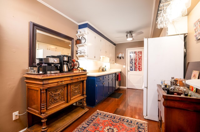 kitchen featuring white cabinets, dark hardwood / wood-style flooring, white fridge, ceiling fan, and crown molding