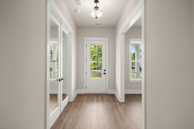 1577 Periwinkle Dr, Mount Pleasant, SC 29466 - foyer entrance with light wood finished floors, healthy amount of natural light, and baseboards