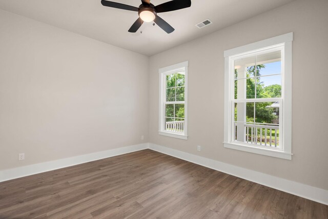 1577 Periwinkle Dr, Mount Pleasant, SC 29466 - empty room featuring baseboards, dark wood-type flooring, and ceiling fan