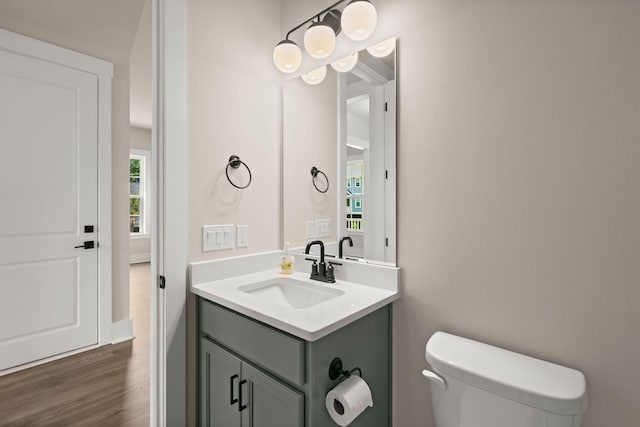 1577 Periwinkle Dr, Mount Pleasant, SC 29466 - half bathroom with vanity, toilet, and wood finished floors