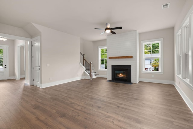 1577 Periwinkle Dr, Mount Pleasant, SC 29466 - unfurnished living room featuring wood finished floors, stairs, ceiling fan, baseboards, and a fireplace