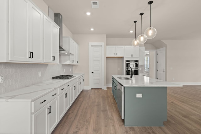 1577 Periwinkle Dr, Mount Pleasant, SC 29466 - kitchen featuring wall chimney exhaust hood, a sink, white cabinetry, appliances with stainless steel finishes, and light wood-type flooring