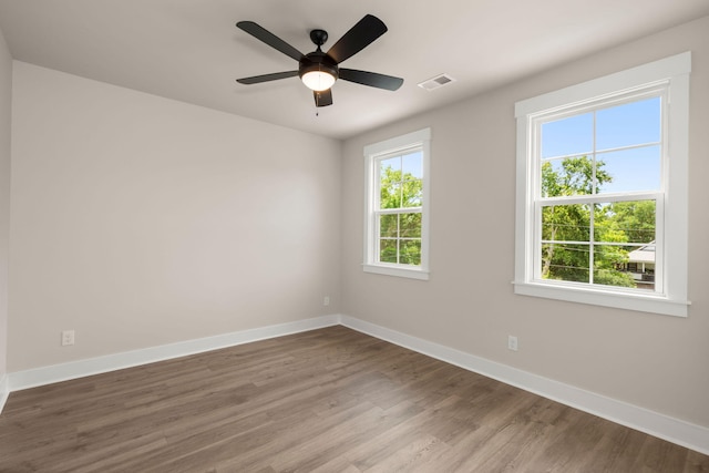 1577 Periwinkle Dr, Mount Pleasant, SC 29466 - unfurnished room featuring plenty of natural light, baseboards, and wood finished floors
