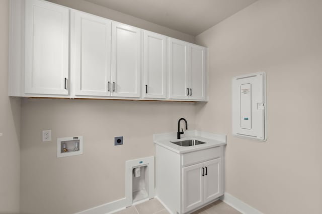 1577 Periwinkle Dr, Mount Pleasant, SC 29466 - laundry room with cabinet space, baseboards, electric dryer hookup, washer hookup, and light tile patterned floors